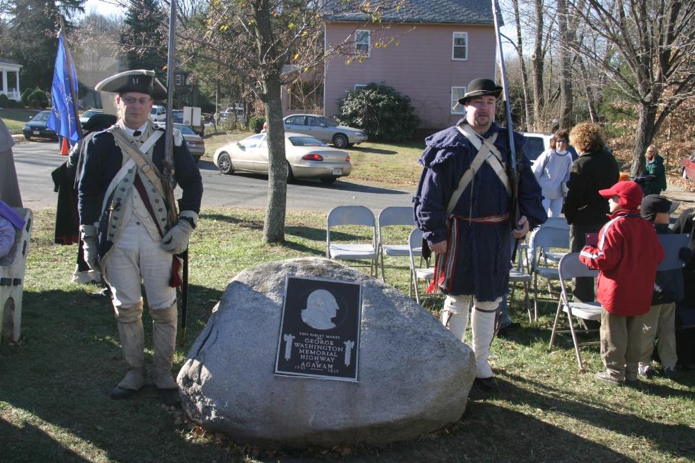Reenactors standing by the George Washington Memorial Plaque